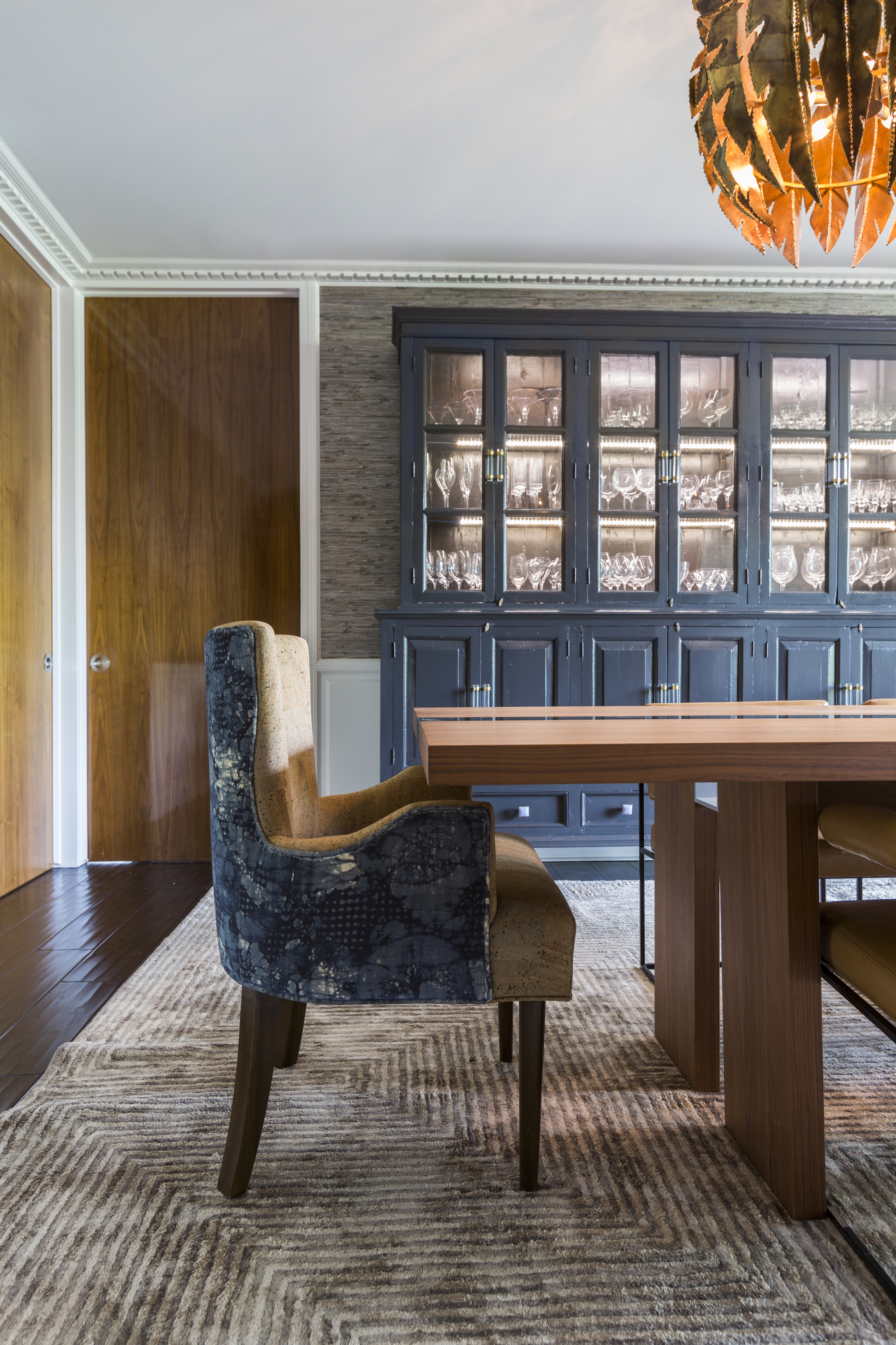 Dark navy antique china hutch in transitional living room - Laura U Interior Design