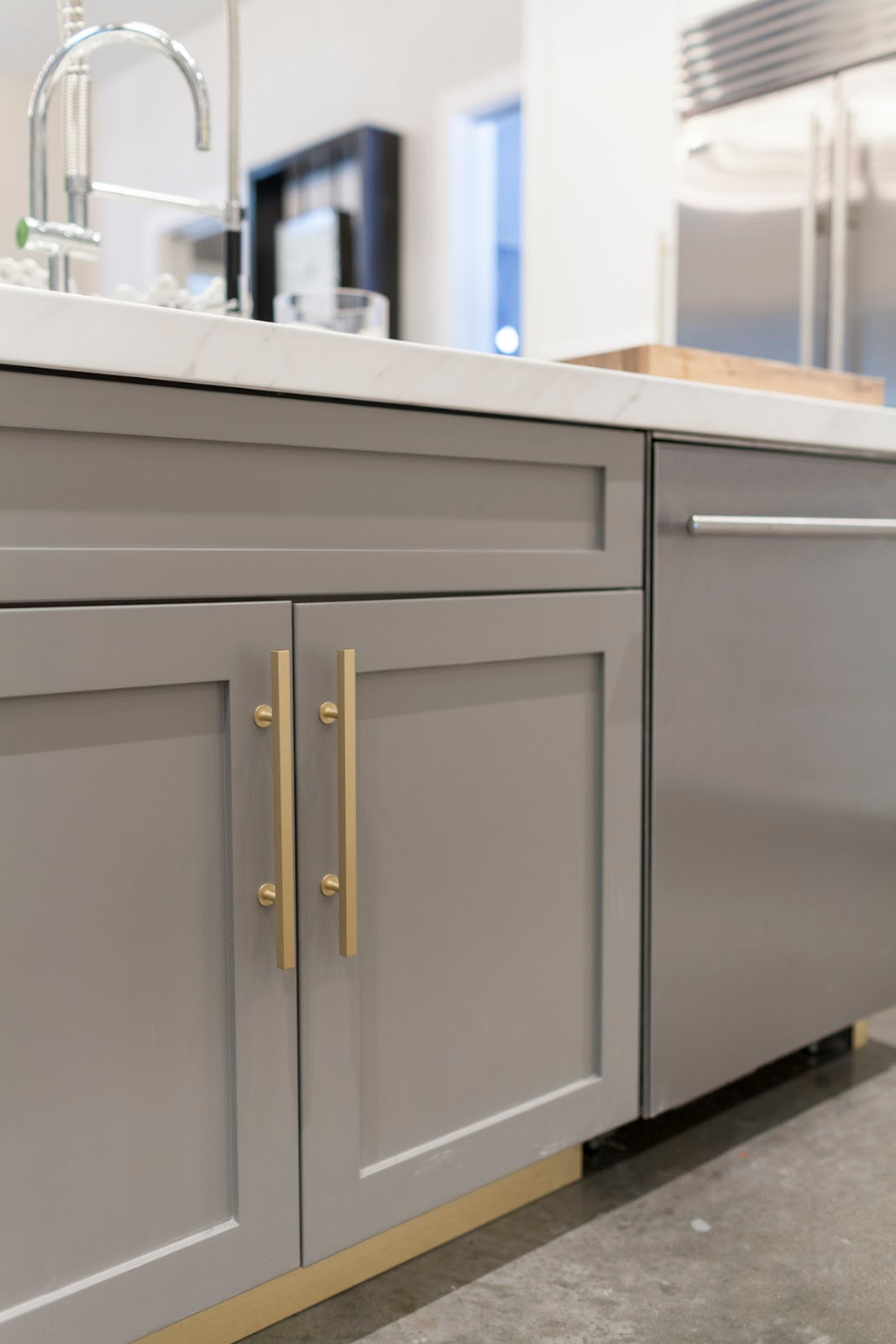 Gray and gold modern kitchen cabinets by Laura U Interior Design